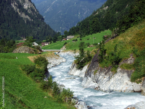 The Chärstelenbach stream in the Maderanertal alpine valley - Canton of Uri, Switzerland photo