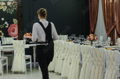 A waiter serving in beautiful banquet hall 
