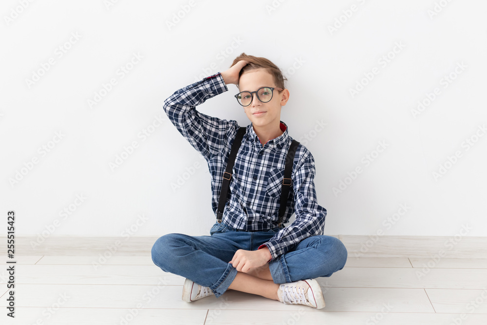 teenager, children and fashion concept - Funny boy with glasses and shirt suspenders teenager, children and fashion concept - Funny boy with glasses and shirt suspenders