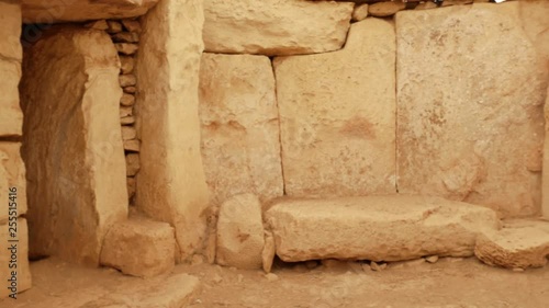 Ancient megalithic stone temple and decorations photo