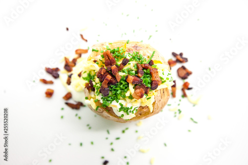 Baked potato with cheese and bacon. Top view