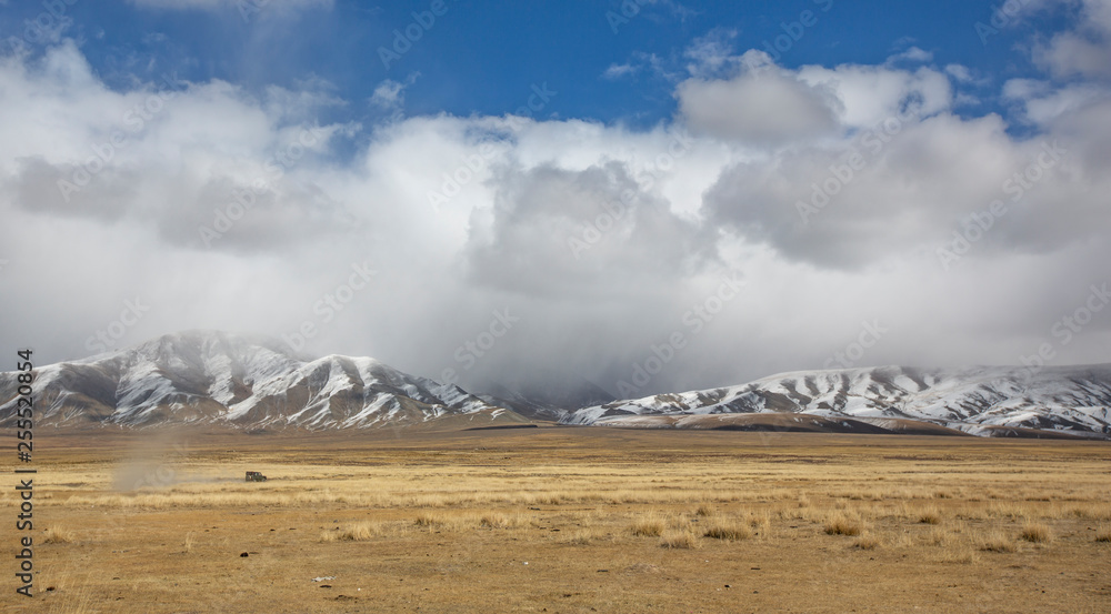 car driving in a landscape of Western Mongolia