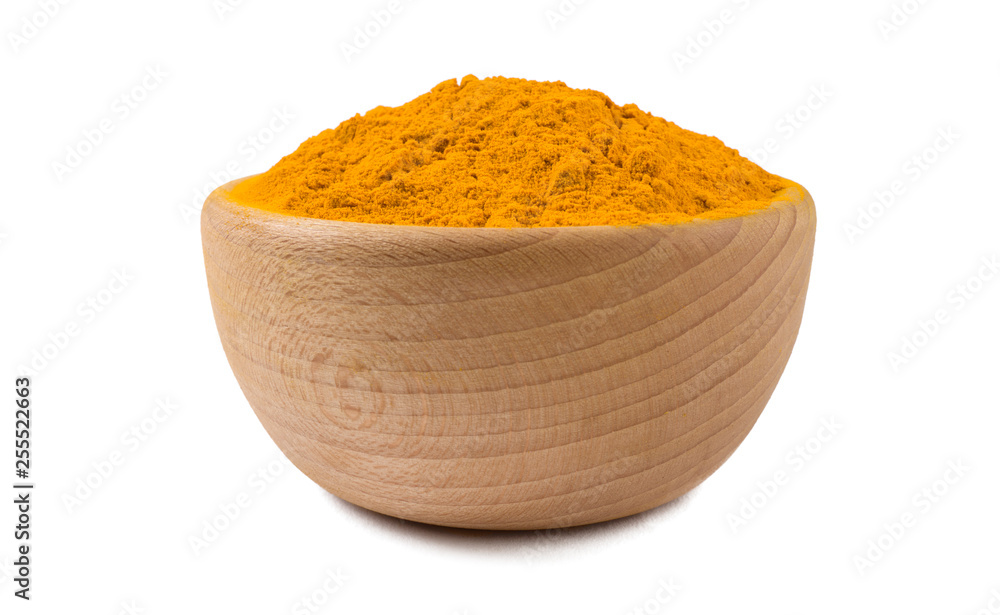 turmeric powder in wooden bowl isolated on white background. Spices and food ingredients. turmeric powder in wooden bowl isolated on white background. Spices and food ingredients.