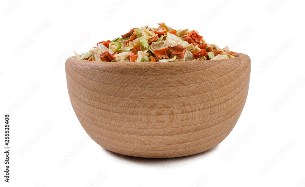 dried vegetables or soup vegetables in wooden bowl isolated on white background. Spices and food ingredients. dried vegetables or soup vegetables in wooden bowl isolated on white background. Spices and food ingredients.