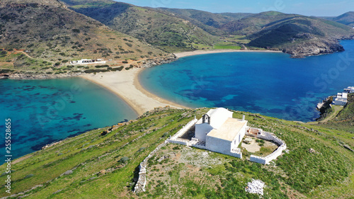 Fototapeta Naklejka Na Ścianę i Meble -  Aerial drone photo of picturesque chapel of Agios Loukas and iconic two sided sandy tropical turquoise sea paradise beach of Kolones and Fykiada in island of Kythnos at spring, Cyclades, Greece