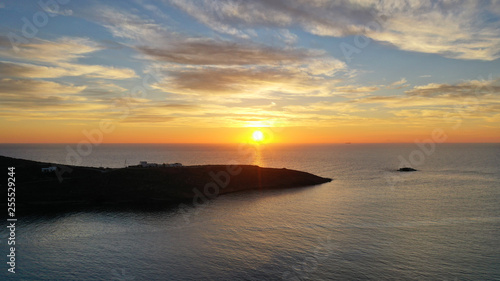 Aerial drone panoramic photo of beautiful sunset over the Aegean sea with golden colours, Greece