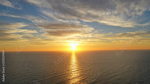 Aerial drone panoramic photo of beautiful sunset over the Aegean sea with golden colours  Greece