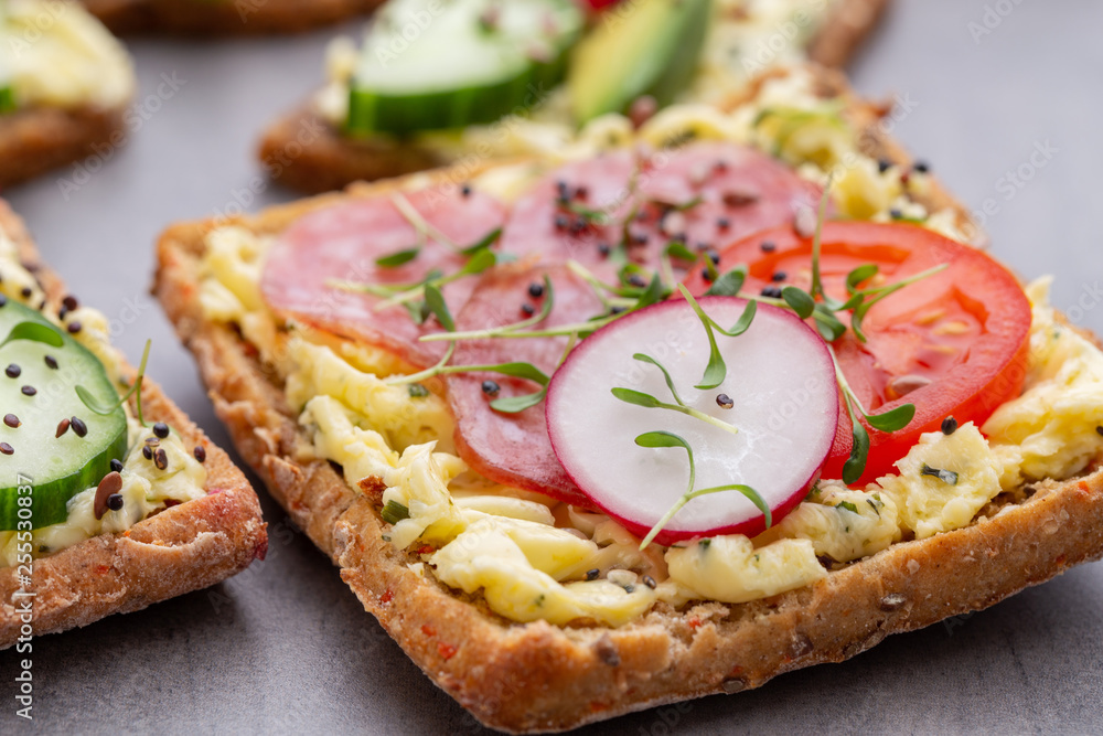 Sandwiches with cream cheese, vegetables and salami. Sandwiches with cream cheese, vegetables and salami.