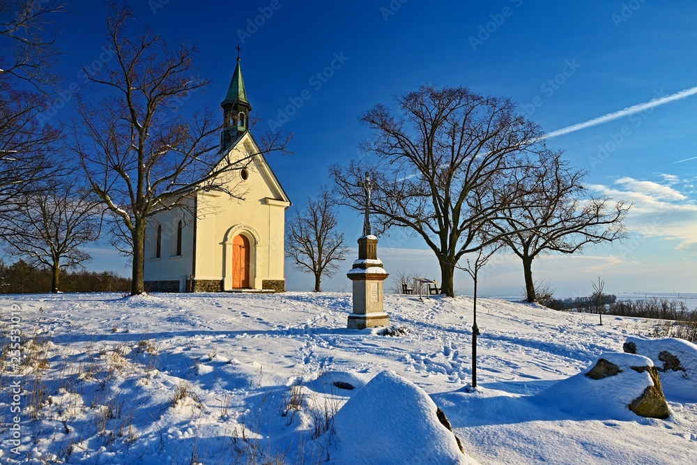 Beautiful winter landscape photo with church. Sunny winter day. Brno - Líšeò. Chapel of Our Lady of Helper.