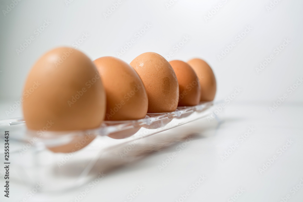 Close up of chicken eggs over white background Close up of chicken eggs over white background