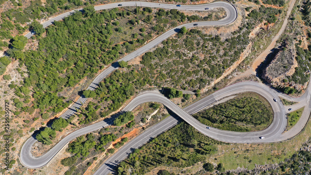 Aerial drone top view photo of snake curvy road built in steep mountain slope Aerial drone top view photo of snake curvy road built in steep mountain slope
