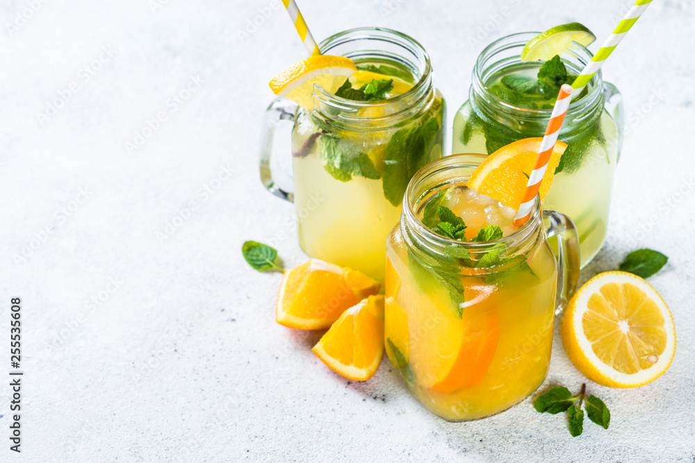 Fototapeta premium Lemonade, mojito and orange lemonade on white.