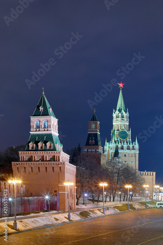 Night or evening view on the illuminated towers of Moscow Kremlin on the Red square in Russian capital with the lanterns in the winter or in the spring 