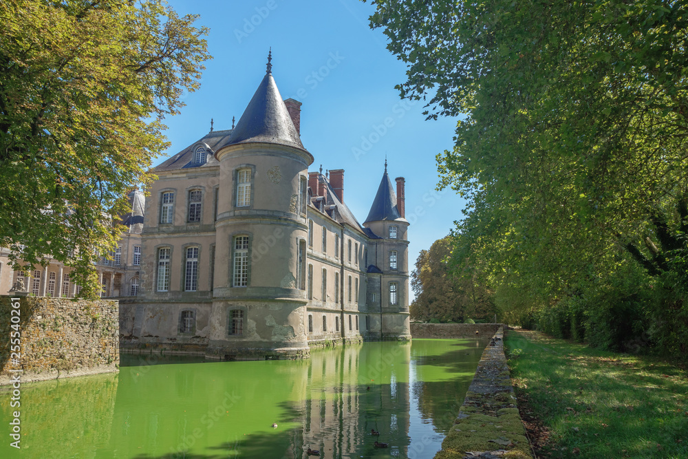 The right side of the Chateau de Haroue with its moat