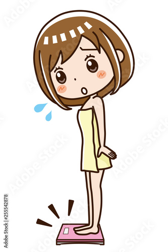 体重計に乗る女性