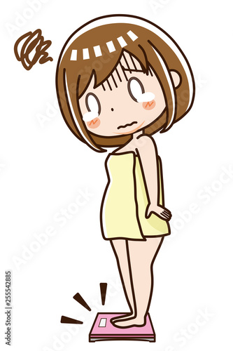 体重計に乗る女性