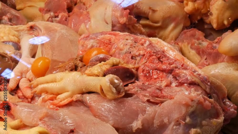 A large number of chicken giblets, entrails, wings, legs, stomachs, livers, hearts and other parts of the chicken carcass A large number of chicken giblets, entrails, wings, legs, stomachs, livers, hearts and other parts of the chicken carcass