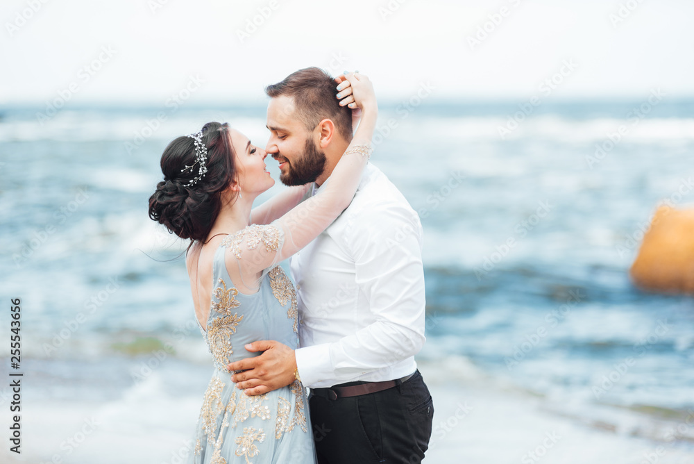 same couple with a bride in a blue dress walk same couple with a bride in a blue dress walk