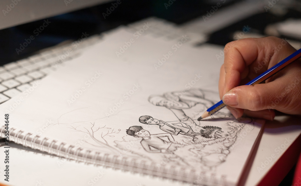 Woman hand drawing on paper Woman hand drawing on paper