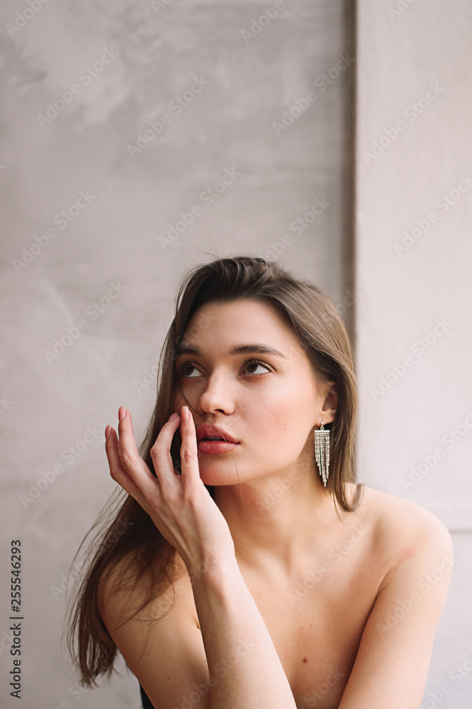 Single young attractive thinking woman with fingers on face Single young attractive thinking woman with fingers on face