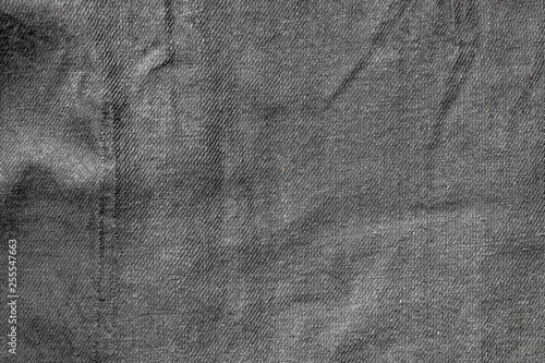 Crumpled dark gray fabric texture as background