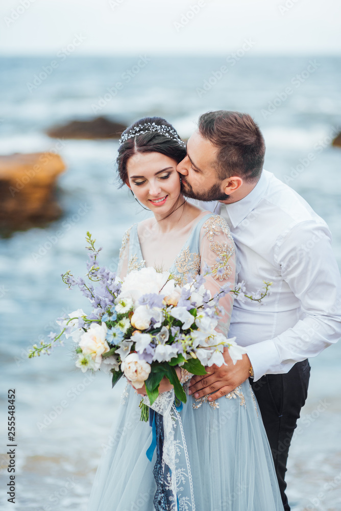 same couple with a bride in a blue dress walk same couple with a bride in a blue dress walk