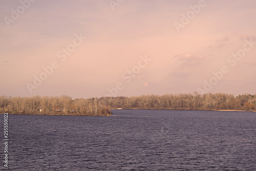 Incredible landscape of the river and the blue sky in nature in the spring. © YAROSLOVEPHOTOVIDEO