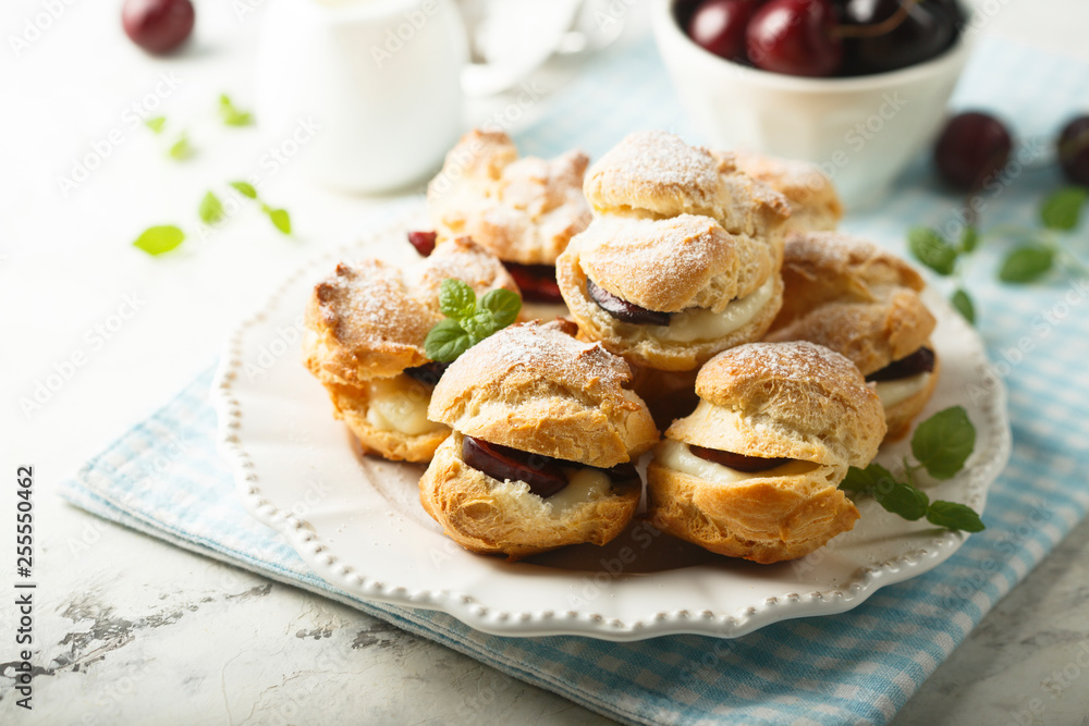 Choux pastry buns with custard and cherry Choux pastry buns with custard and cherry