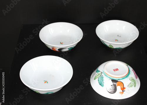 Traditional thai ceramic bowls with chicken pattern