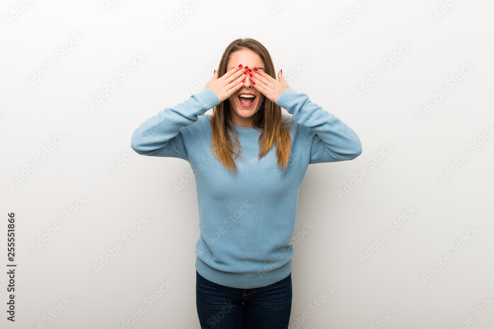 Blonde woman on isolated white background covering eyes by hands. Surprised to see what is ahead Blonde woman on isolated white background covering eyes by hands. Surprised to see what is ahead