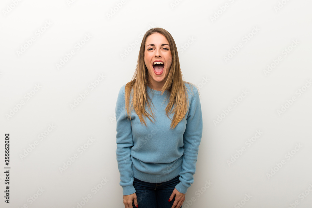 Blonde woman on isolated white background shouting to the front with mouth wide open Blonde woman on isolated white background shouting to the front with mouth wide open