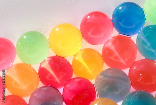 Water coloured gel balls. Polymer gel. Silica gel. Balls of blue hydrogel. Crystal liquid ball with reflection. Texture background. Close up macro © Катя Козлова