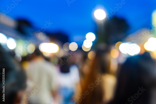 Group of blurred people shopping in outdoor market