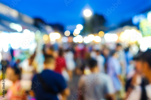Group of blurred people shopping in outdoor market