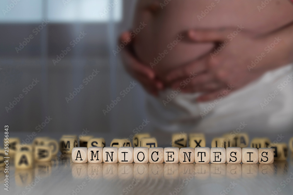 Εκτύπωση καμβά Word AMNIOCENTESIS composed of wooden letters.