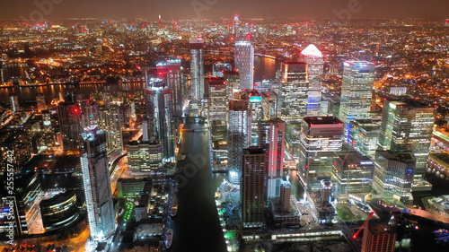 Aerial drone night shot from iconic Canary Wharf skyscrapers business area  Isle of Dogs  London  United Kingdom  