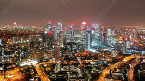 Aerial drone night shot from iconic Canary Wharf skyscrapers business area  Isle of Dogs  London  United Kingdom  