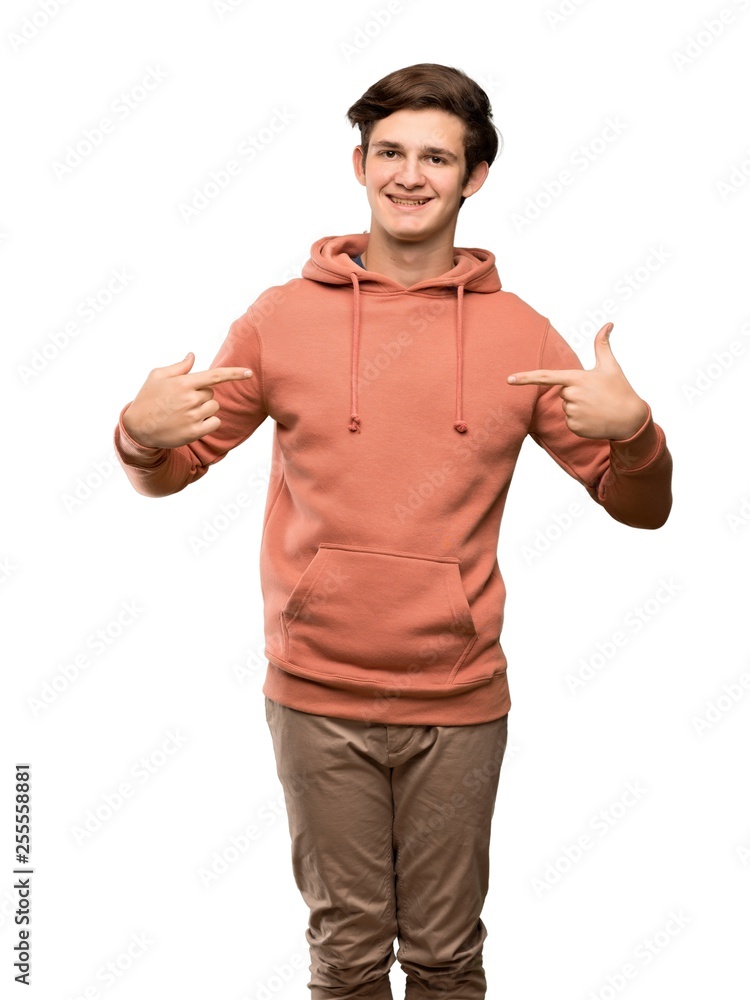 Teenager man with sweatshirt proud and self-satisfied over isolated white background Teenager man with sweatshirt proud and self-satisfied over isolated white background