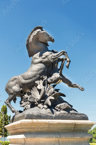 Sculpture of famous French nineteenth sculptor Emmanuel Fremiet. Lioness attacking a horse in Polish park Swierklaniec.