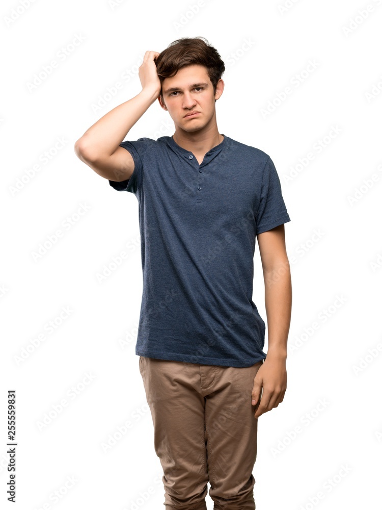 Teenager man with an expression of frustration and not understanding over isolated white background Teenager man with an expression of frustration and not understanding over isolated white background