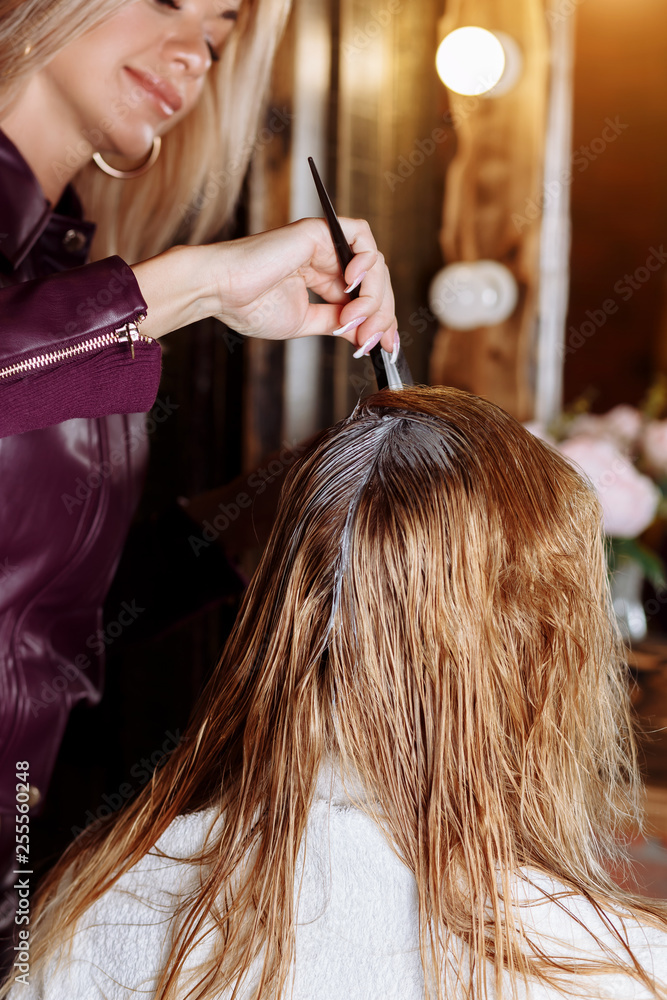 Naklejka premium Beautiful woman in hair salon