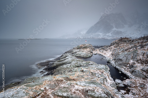 Rocks falling into the sea. Hamnoy, Lofoten islands, Norway photo