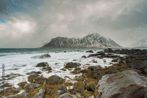 Rocks falling into the sea near Skagsanden beach. Lofoten islands  Norway