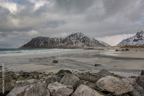 Rocks falling into the sea near Skagsanden beach. Lofoten islands, Norway