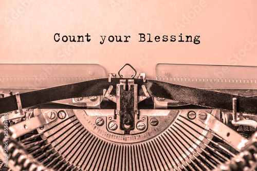 Count your Blessings printed on a sheet of paper on a vintage typewriter. journalist, writer.