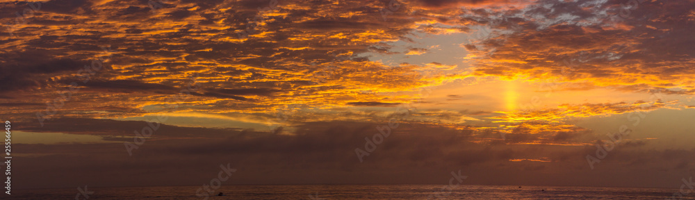 panoramic veiw of orange sunrise over the ocean