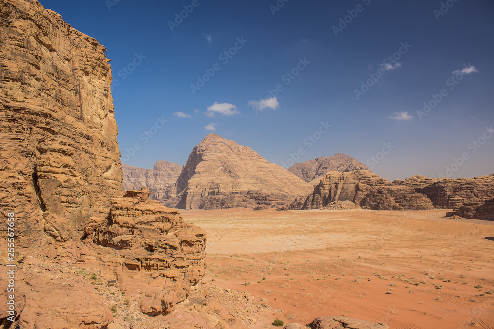 Middle East picturesque bare mountain ridge and big sand valley desert scenery landscape travel photography Middle East picturesque bare mountain ridge and big sand valley desert scenery landscape travel photography