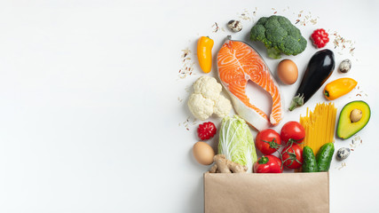 Supermarket. Paper bag full of healthy food.