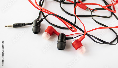 Black and red headphones on a white background.
