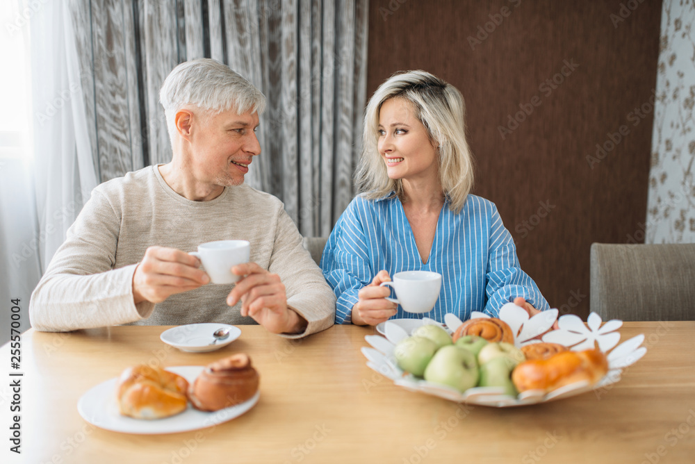 Breakfast of adult love couple at home